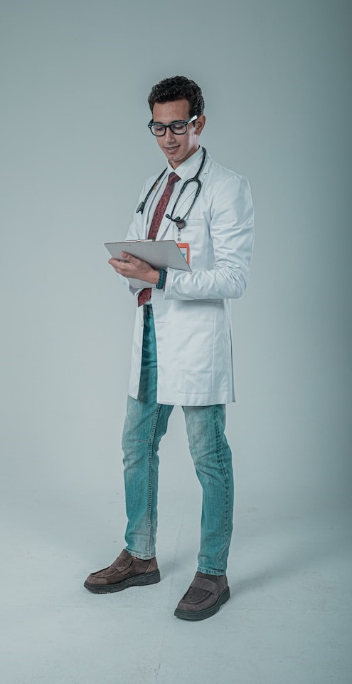 male-doctor-in-lab-coat-with-clipboard